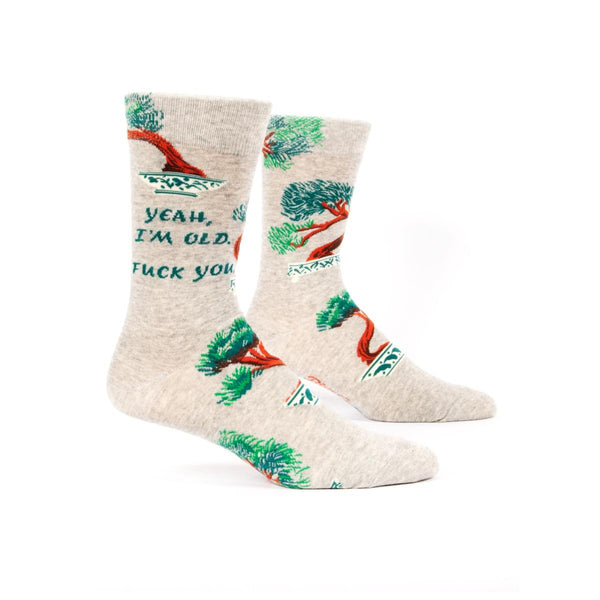 Heather grey socks with bonsai on it; they read "Yeah, I'm Old. Fuck you."