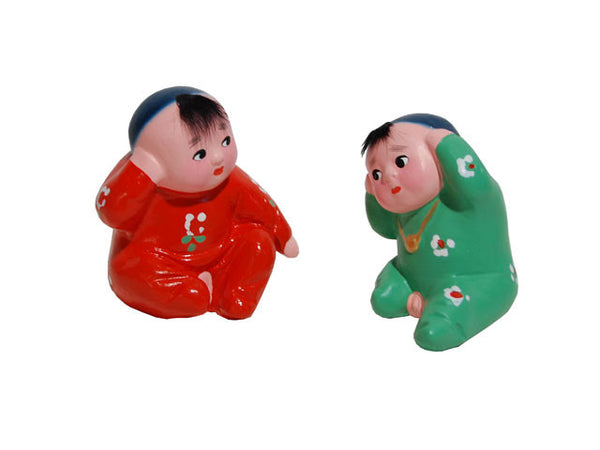 Hand Painted Clay Figurine. Hearing Firecrackers