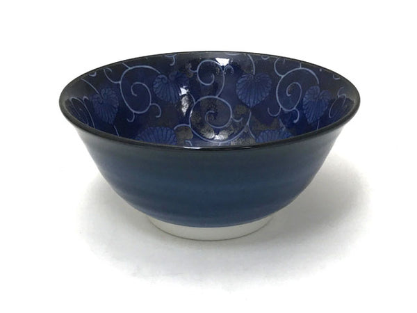 Alluring dark blue bowl with lighter blue curling vines and leaves design