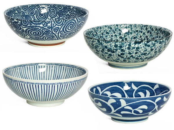 A set of four ornately designed blue and white bowls perfect for any meal or snack 