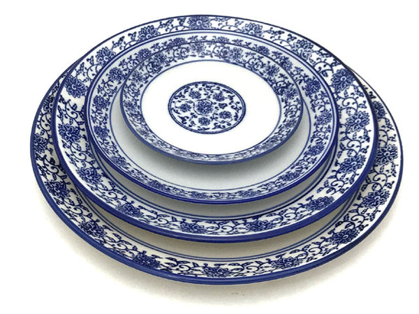 4 round plates in a blue lotus and vine pattern, each in different sizes. 