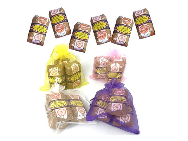 Mini sandalwood soap gift pack. Four sacks, each holding 3 bars of soap. 6 bars of soap above the sacks