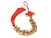 coin ornament with red tassel holding ten coins. The border of the knot is gold-colored
