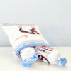 White Bunny Candy Sneak-Treat Dog Toy: mostly white bag and white candy pieces with pink and blue illustration for white bunny candy, candy falling out of bag