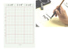 9x12 calligraphy sheet. 12 red squares, with one length of it measuring 3.125", overlapping the grid. On the right is a person writing a character on the calligraphy sheet