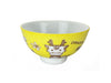A bright yellow bowl decorated with an energetic zodiac dragon