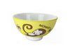 A bright yellow bowl decorated with a happy zodiac monkey