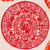 Intricate red paper cut decoration featuring the animals of the Chinese zodiac and a phoenix at the center